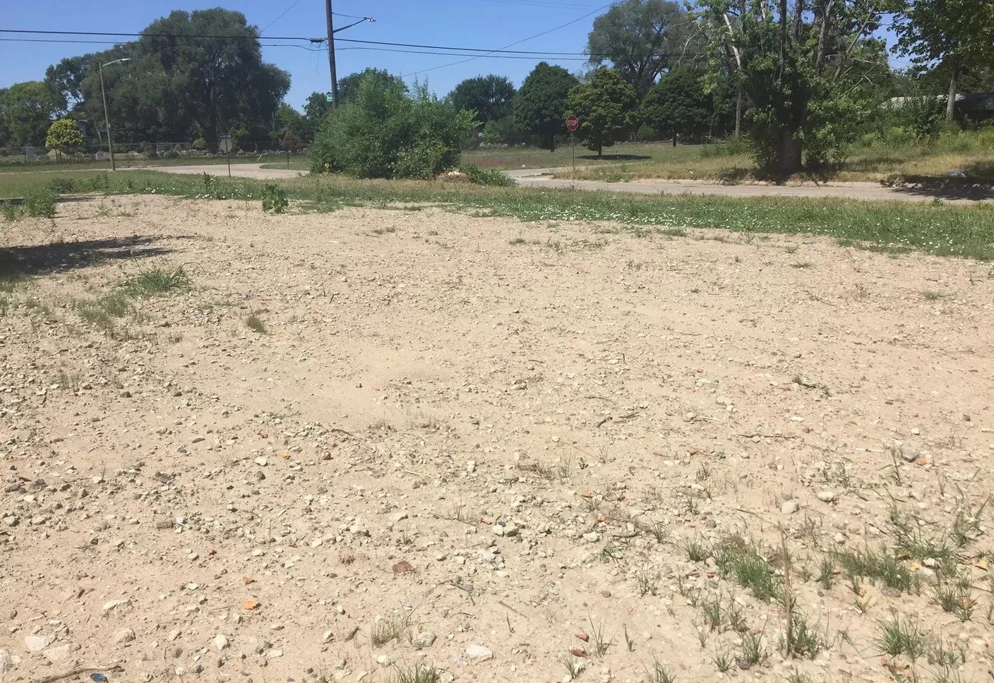 Empty graded dirt lot left after a house was removed